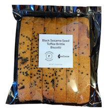 Load image into Gallery viewer, Clear bag with 6 pieces of sesame biscotti with a label stating "Black Sesame Seed Toffee Brittle Biscotti" NeoCocoa and Roxann's Biscotti logos