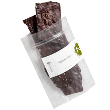 Load image into Gallery viewer, Clear bag of 3oz dark chocolate pistachio bark pouring out of bag. Label states, “Pistachio Bark” with NeoCocoa logo.