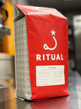 Load image into Gallery viewer, Red and white Ritual Coffee bag with their logo and label