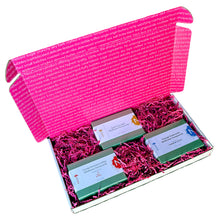 Load image into Gallery viewer, Open rectangle gift box lid up with view of  3 - 3oz green boxes of honeycomb with pink crinkle paper cushion between the boxes. 