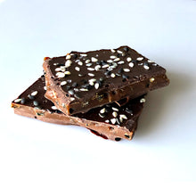 Load image into Gallery viewer, Close up of 2 pieces sesame brittle candy as may be found in the 1oz sized package.