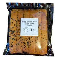 Load image into Gallery viewer, Clear bag with 6 pieces of sesame biscotti with a label stating &quot;Black Sesame Seed Toffee Brittle Biscotti&quot; NeoCocoa and Roxann&#39;s Biscotti logos