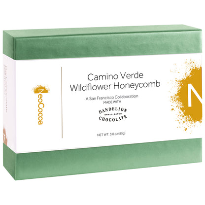 2 dimensional angle of closed 3oz green box with a white label wrapped through the center of the box titled "Camino Verde Wildflower Honeycomb" with golden colored NeoCocoa logo and net weight 3.0 (85g) 