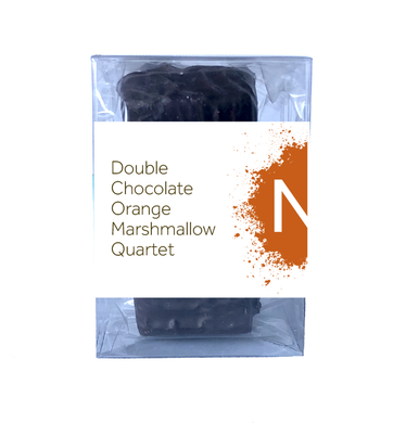 Front side of dark chocolate covered chocolate marshmallows in the clear bag in a clear box, wrapped with a label stating “Double Chocolate Orange Marshmallow Quartet” and NeoCocoa logo.