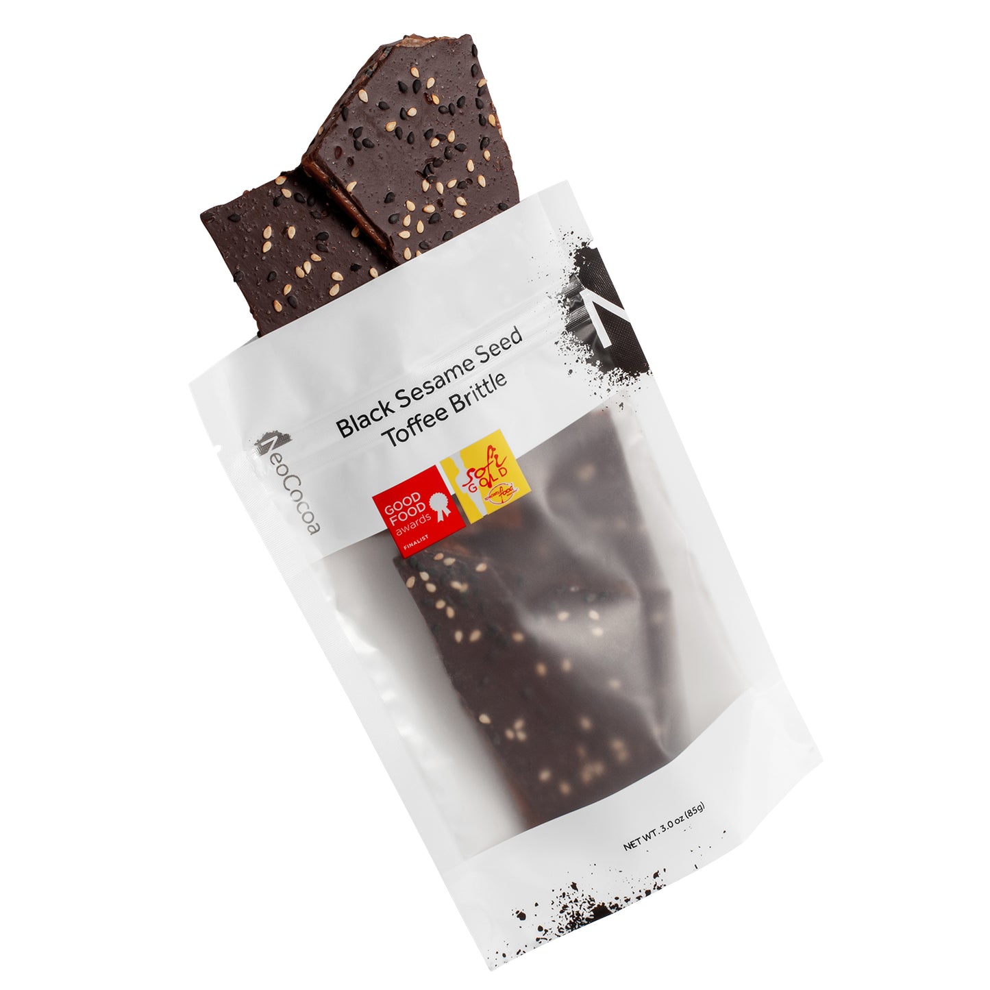 Sesame brittle pouring out of 3oz sized white bag stating “Black Sesame Seed Toffee Brittle” and NeoCocoa logo, with a Good Food Award sticker and a SOFI Gold award sticker.