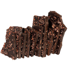 Load image into Gallery viewer, Close up of several pieces of nib brittle candy stacked.